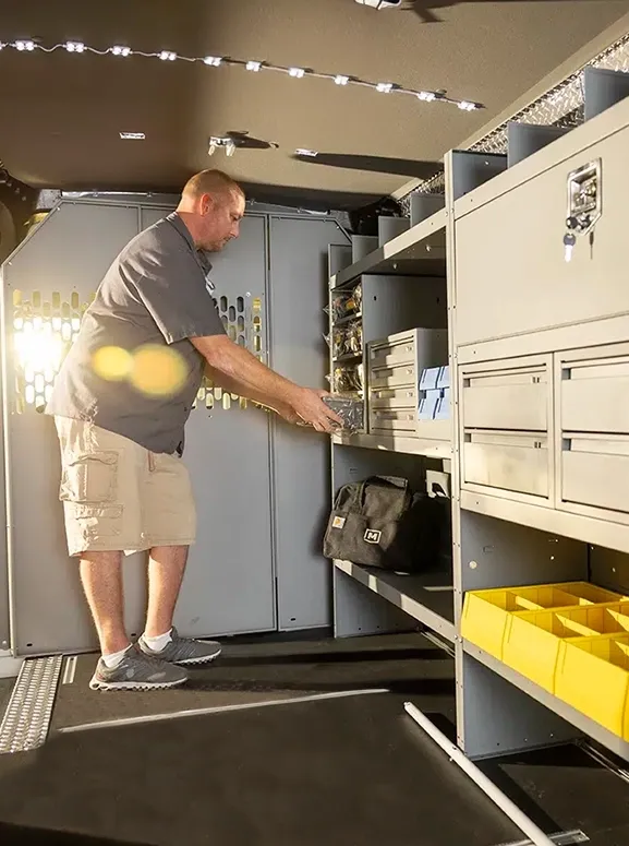 Upfitted with shelving and storage inside a work van