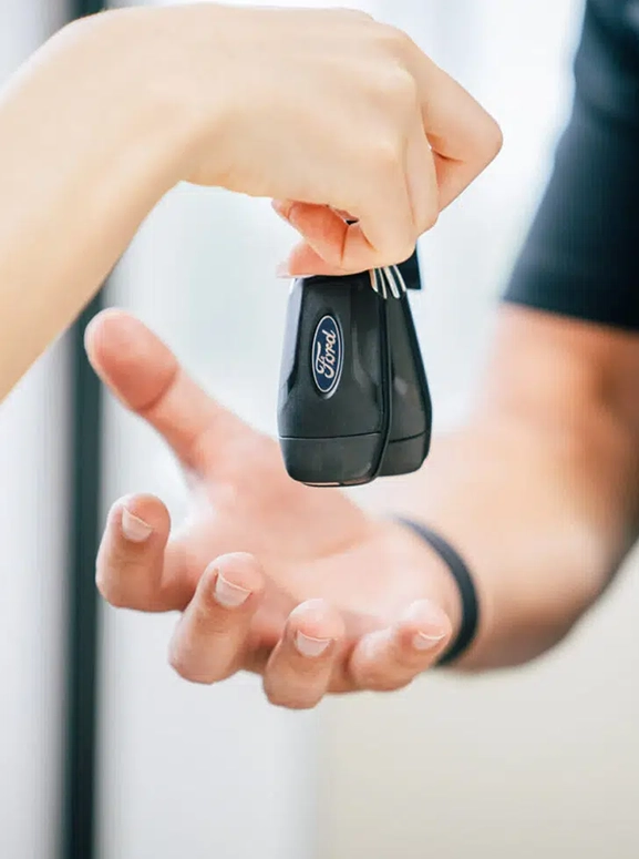 keys are being handed over after a financing agreement in Chino