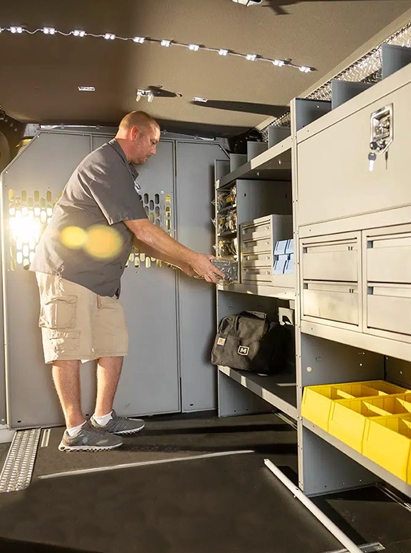 Inside of an upfitted truck with stores and shelves
