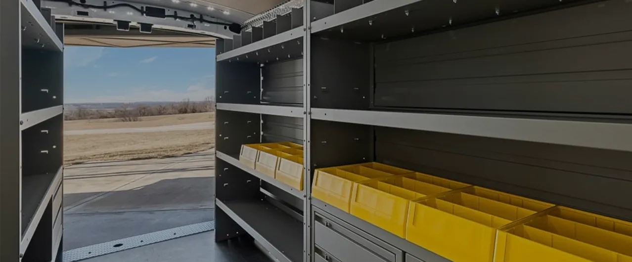 a man putting items away in an upfitted truck
