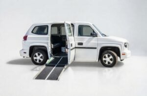 MV-1 Van with ADA Wheelchair Ramp Deployed on White Background