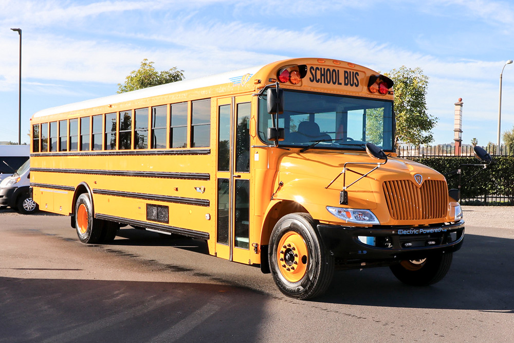 A yellow IC Bus CE 3402 school bus parked in a parking lot.