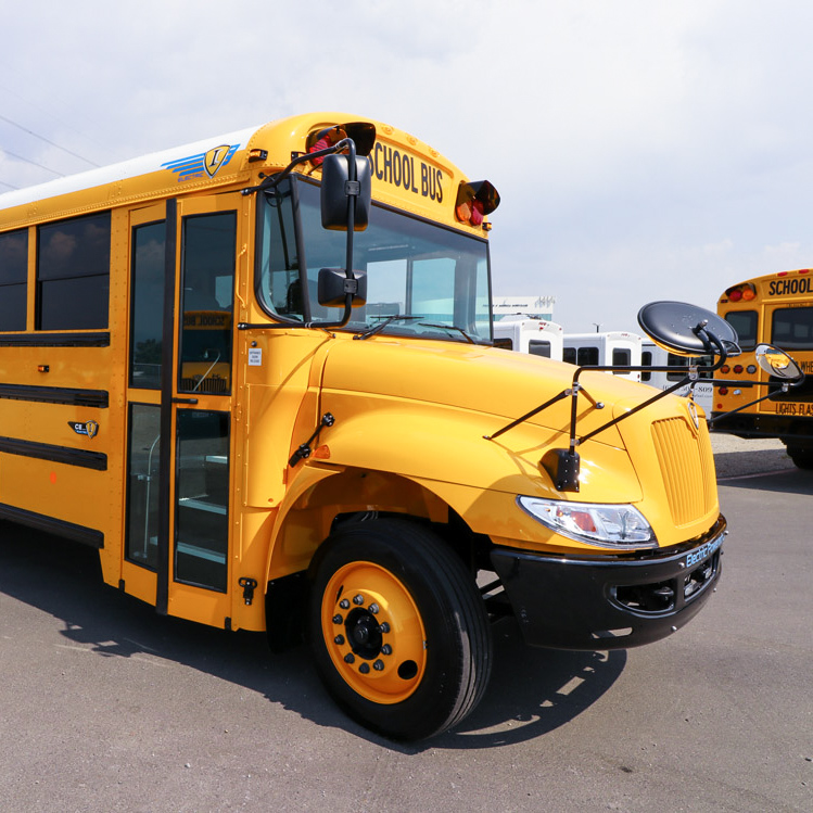 A yellow IC school bus parked in a parking lot.