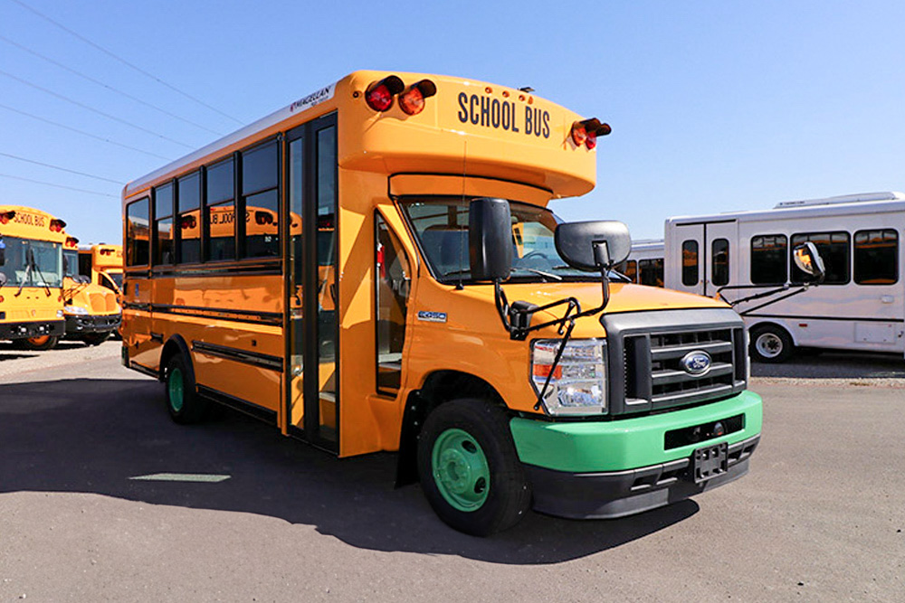 A Magellan by Collins school bus parked in a parking lot.