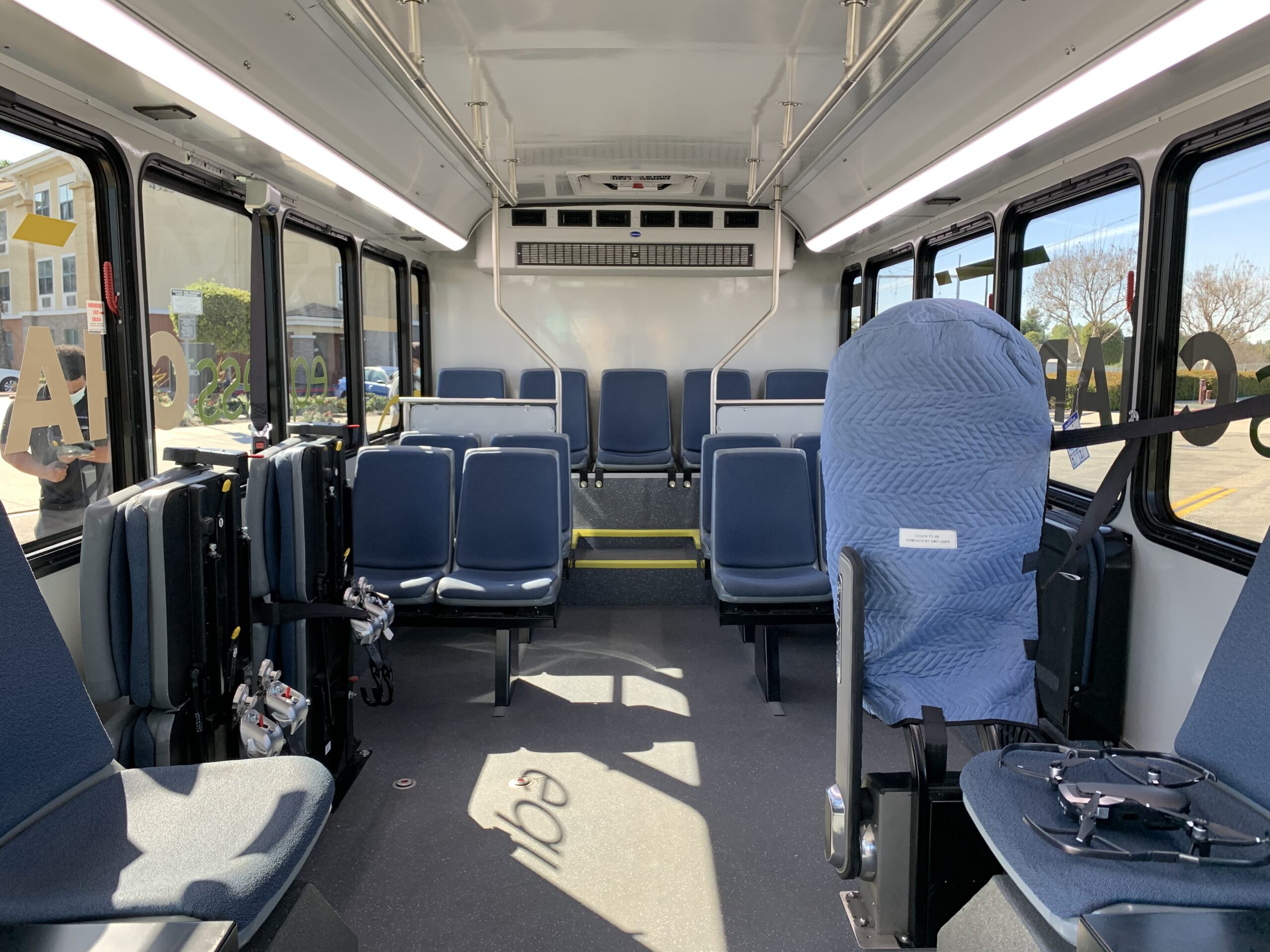 The 2021 ARBOC Equess CHARGE bus with blue seats.