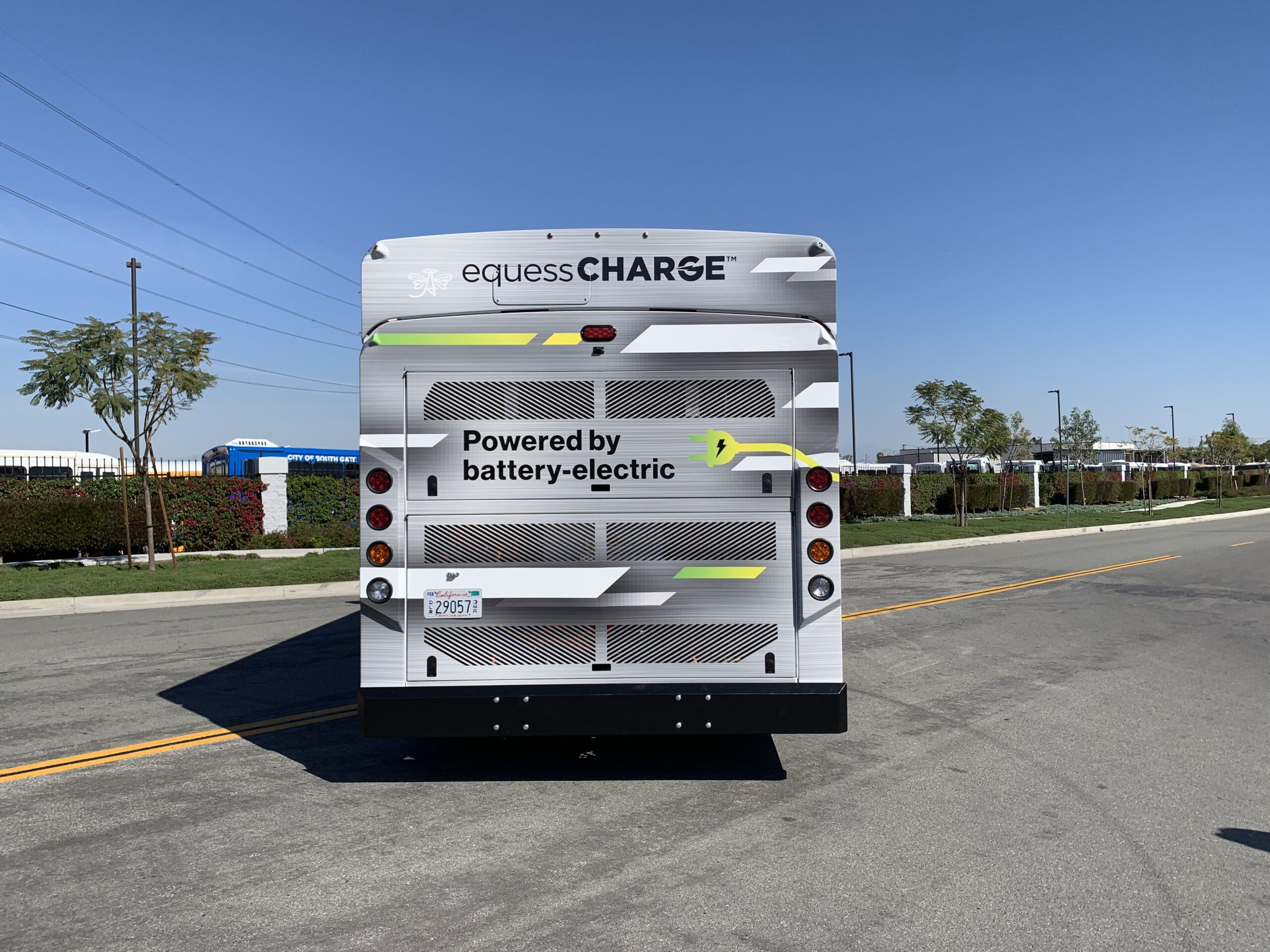 A 2021 ARBOC Equess CHARGE bus is parked on the side of the road.