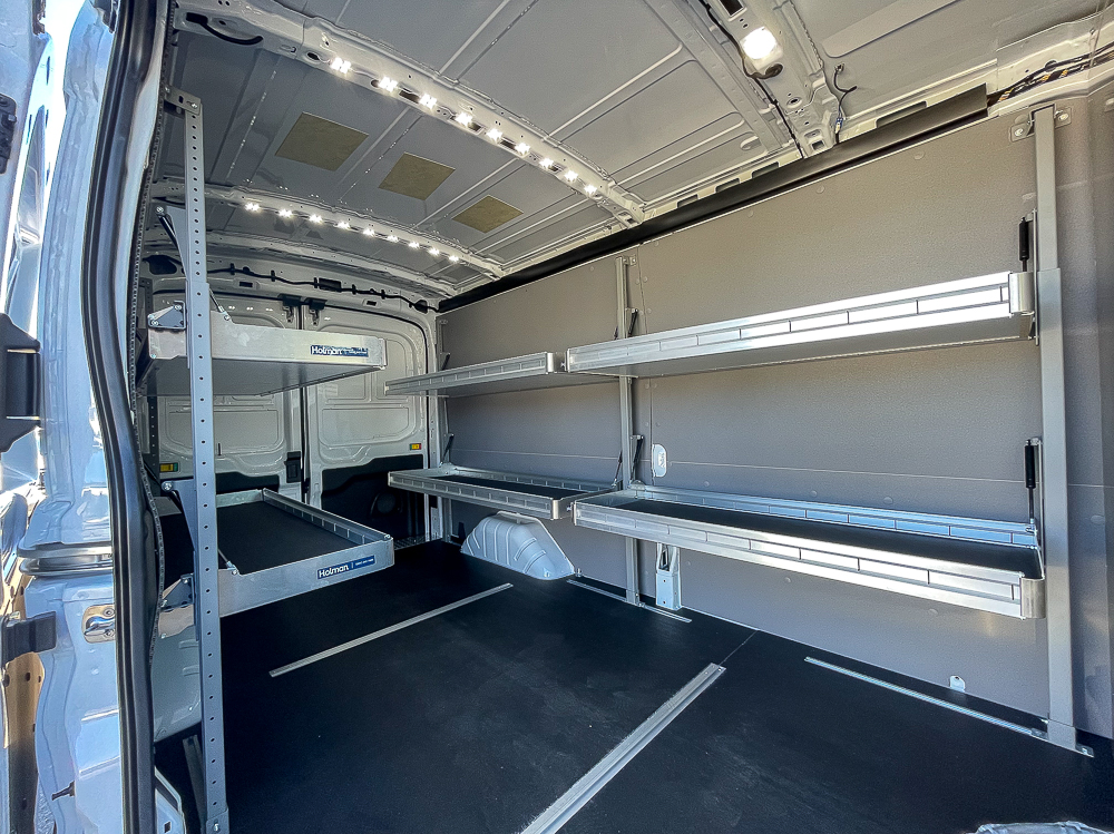 E-Transit Cargo - sliding door looking into interior with folding shelves down