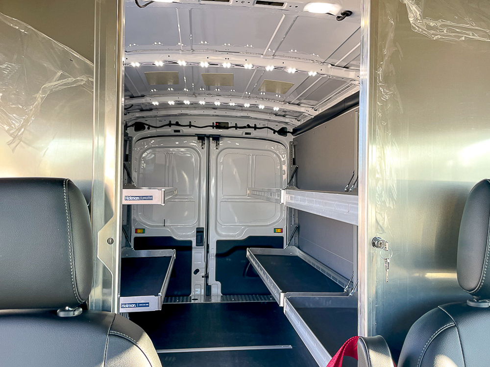 E-Transit Cargo - looking into interior with folding shelves down from driver's compartment