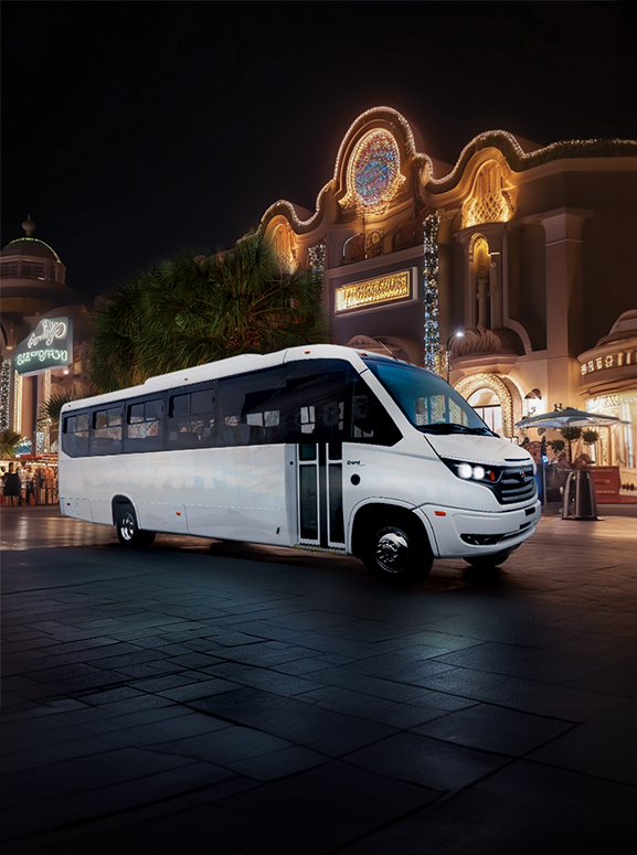 White bus in front of a casino at night