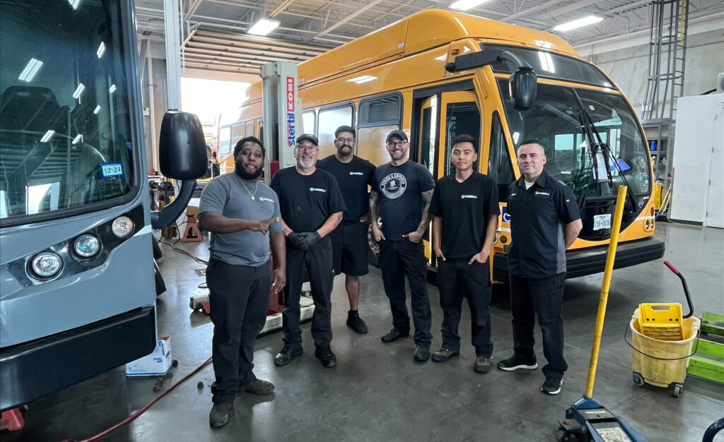 Service techs in a commercial vehicle shop