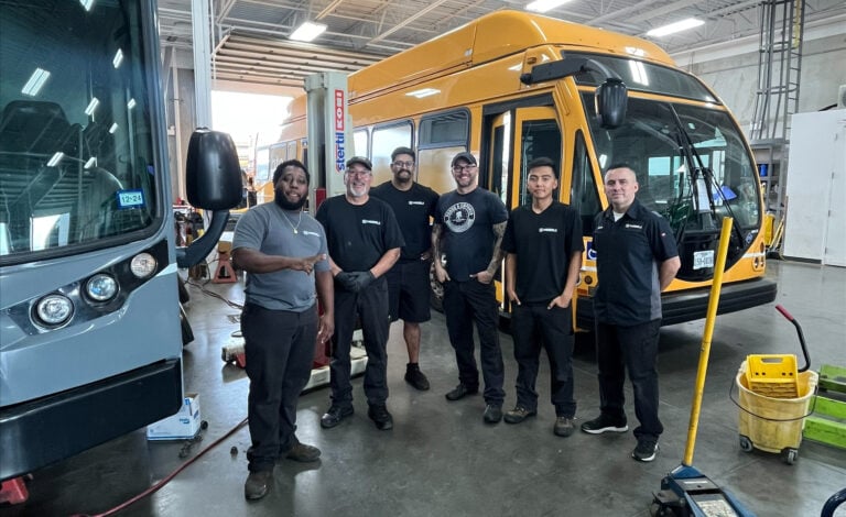 Service techs in a commercial vehicle shop