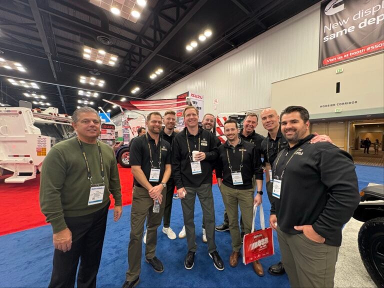 Model 1 team members at Work Truck Week 2026 on the exhibit floor
