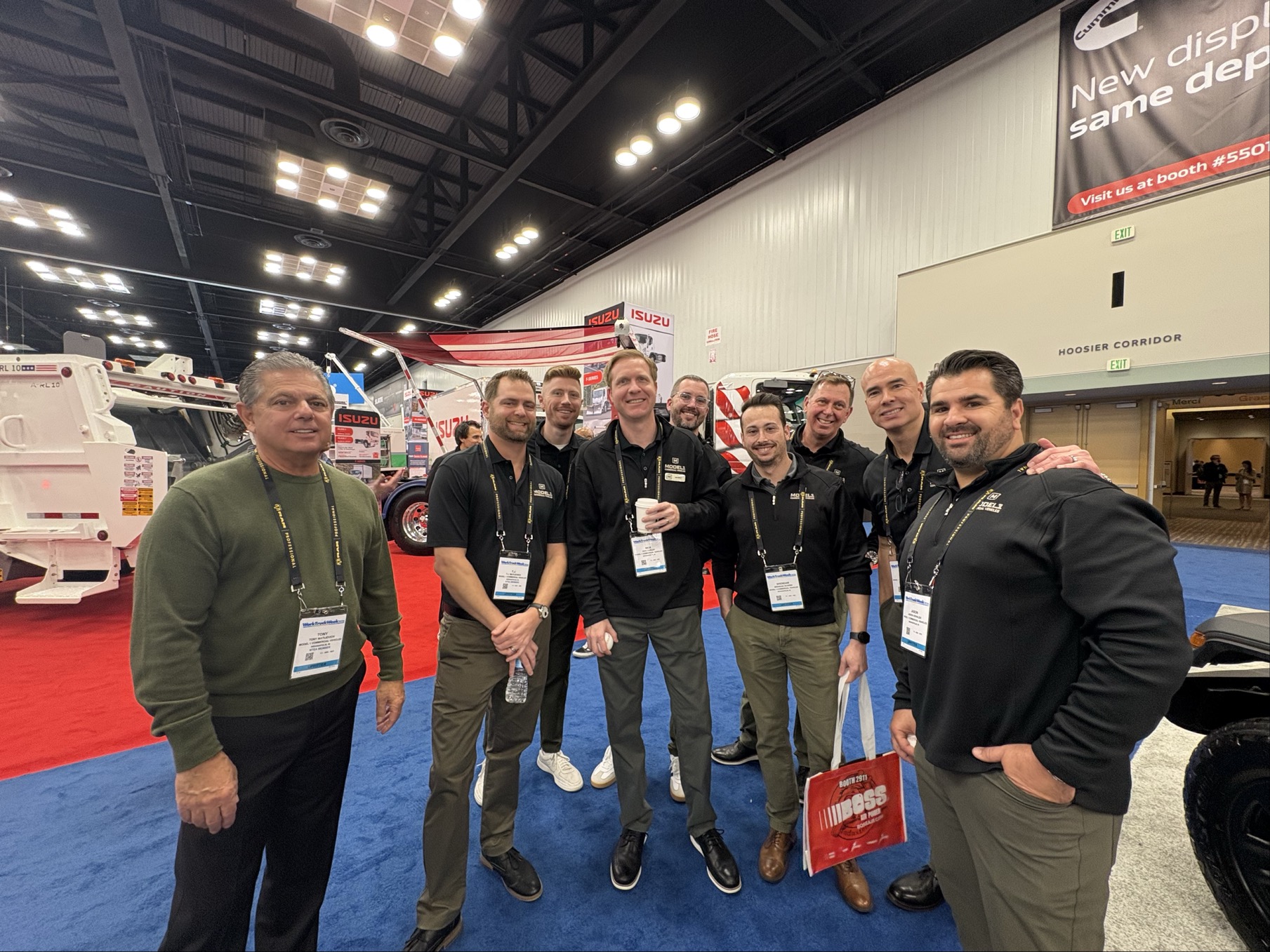 Model 1 team members at Work Truck Week 2026 on the exhibit floor