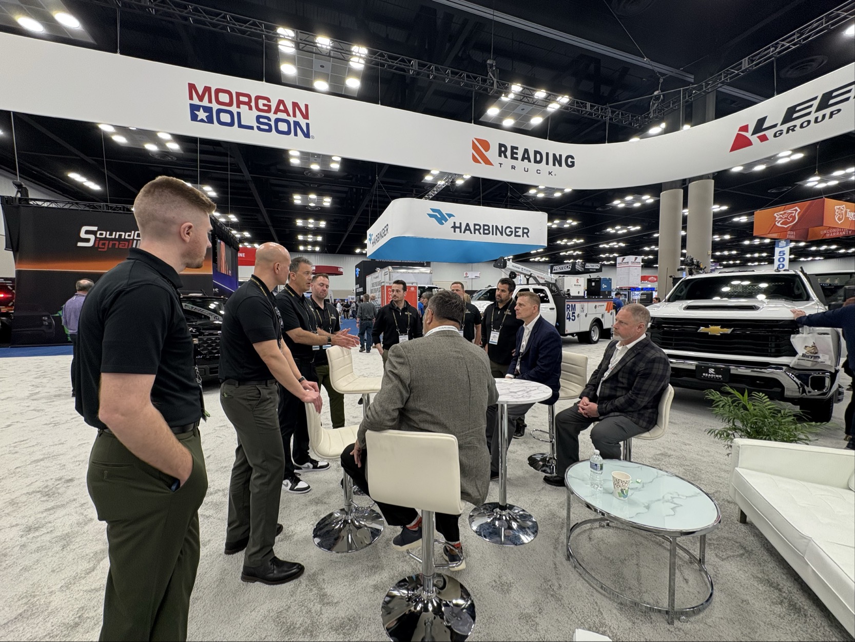 Fleet professionals and Model 1 team discussing commercial vehicle solutions at Work Truck Week 2026